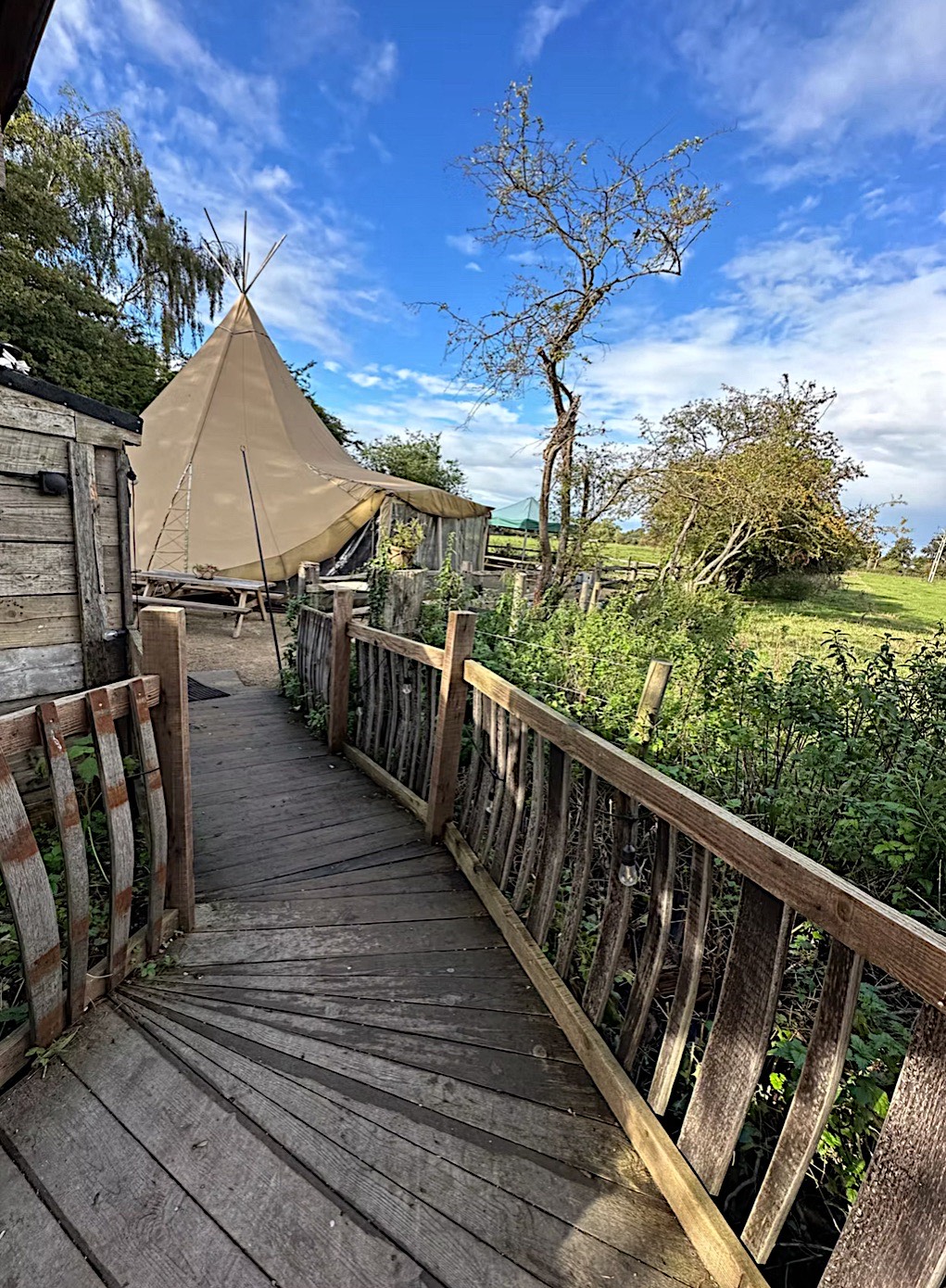 FullSizeRender_VSCO (2) Image of a tipi and boarded wooden walkway